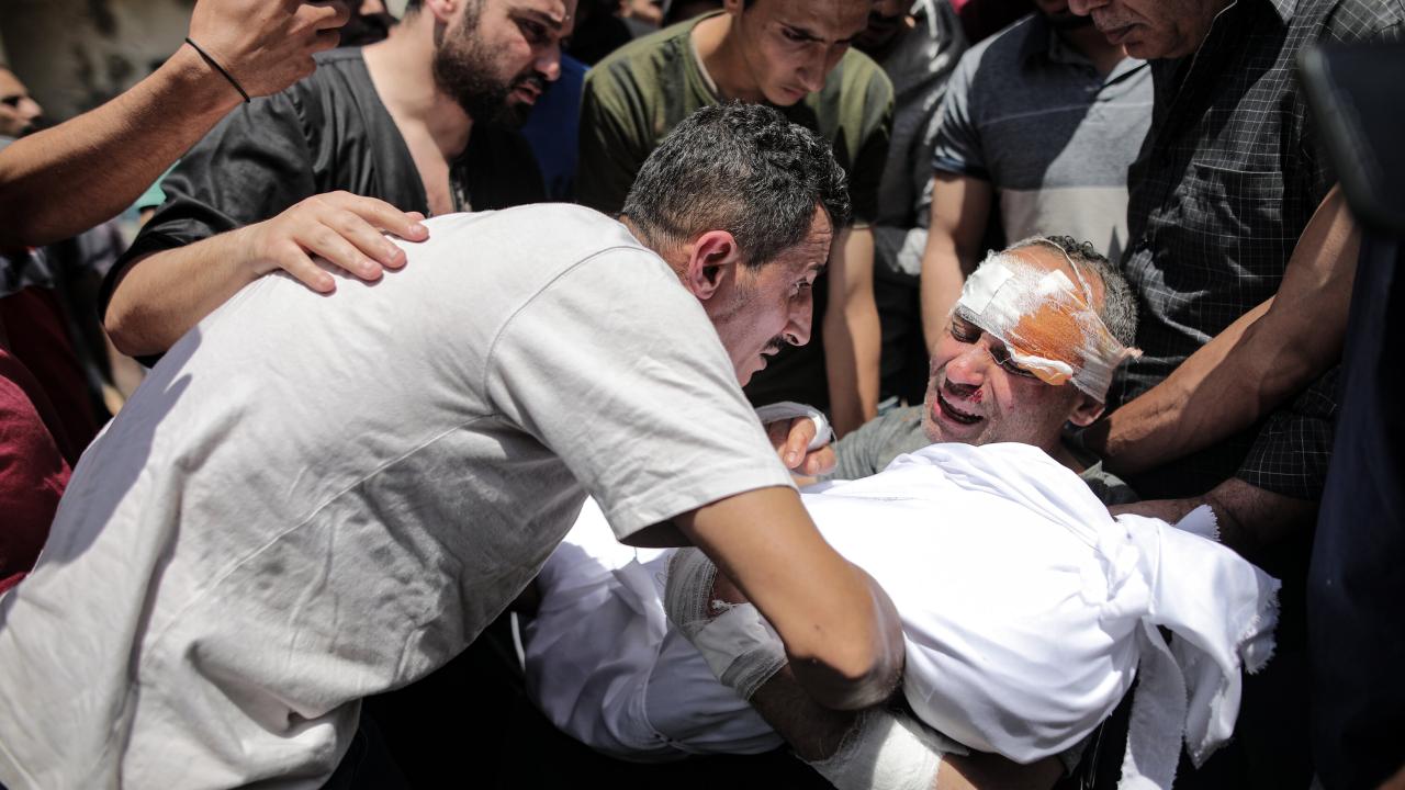 Gaza israel refugee gazans palestinians israelis rubble israeli conflict mosque clash subdued qassam watched rescuers